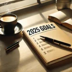 Journal on desk with 2025 goals list and coffee cup.